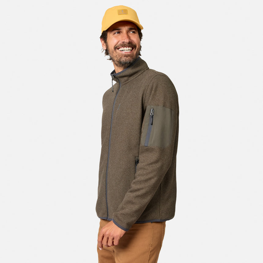 [Model is wearing size M.] A man wearing a brown fleece jacket with a gray chest pocket and a yellow cap, shown from a side profile against a light gray background.