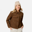 [Model is wearing size S.] A woman wearing a brown suede-like button-front jacket with flap chest pockets, paired with a beige beanie and light pants, photographed against a clean light gray studio background.