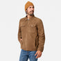 [Model is wearing size M.] A man wearing a brown suede jacket, blue jeans, and a mustard yellow beanie, standing against a light gray studio background.