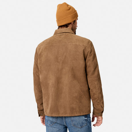 [Model is wearing size M.] A man viewed from behind wearing a tan suede jacket, a mustard yellow beanie, and blue jeans against a light gray studio background.
