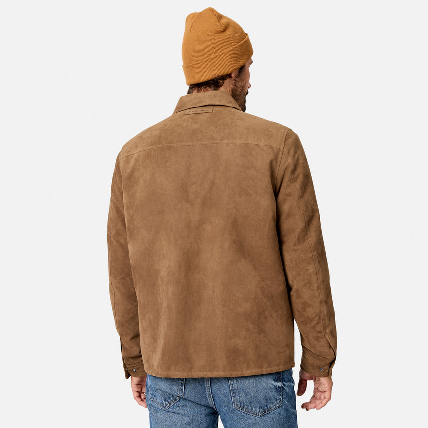 [Model is wearing size M.] A man viewed from behind wearing a tan suede jacket, a mustard yellow beanie, and blue jeans against a light gray studio background.
