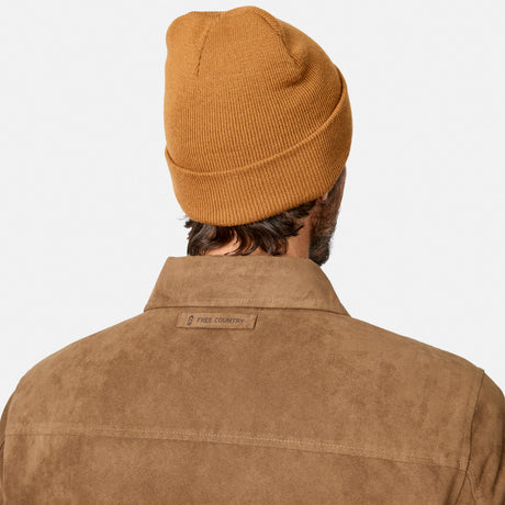 [Model is wearing size M.] Back view of a man wearing a ribbed mustard yellow beanie and a brown suede-like collared shirt jacket with a 'FREE COUNTRY' label on the collar, against a light gray background.