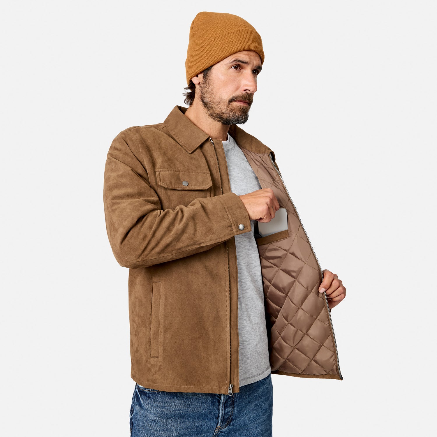 [Model is wearing size M.] A man wearing a brown suede jacket with a quilted lining, a gray t-shirt, blue jeans, and a mustard yellow beanie, shown against a light gray background.