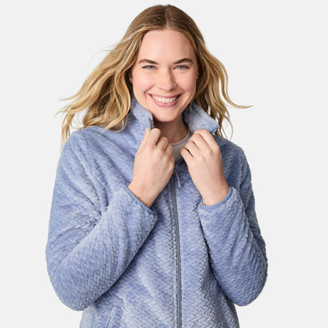[CJ is 5'10" wearing size S.] Woman wearing a blue quilted jacket on a white background