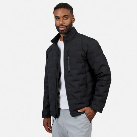 [Model is wearing size M.] A man wearing a black puffer jacket over a white t-shirt and light gray pants, standing against a light gray studio background.