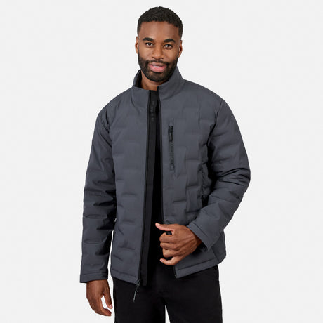 [Model is wearing size M.] A man wearing a dark gray puffer jacket with a black front zipper and a vertical zippered pocket on the chest, paired with black pants, against a light gray background.