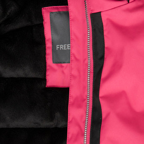 [Model is wearing a size Medium.] Girl wearing the Free Country Girls' Boarder Jacket in bright pink and black, featuring Butter Pile® lining, a wind- and water-resistant shell, and a hooded design.