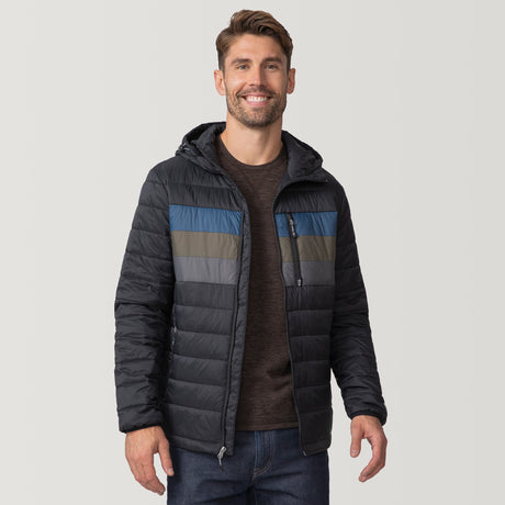 [Matt is 6'2" wearing a size Medium.] Man wearing the Free Country Men's Tri-Color Hooded Puffer Jacket in black with horizontal stripes in blue, brown, and grey, standing against a plain light background.