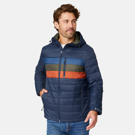 [Matt is 6'2" wearing size M.] Men’s Free Country zip-front puffer jacket in navy with multicolored horizontal chest stripes—featuring full-length zipper closure, insulated design, and classic hood-free silhouette. Paired with a white shirt and blue jeans for a vibrant, cold-weather look with retro-inspired flair.