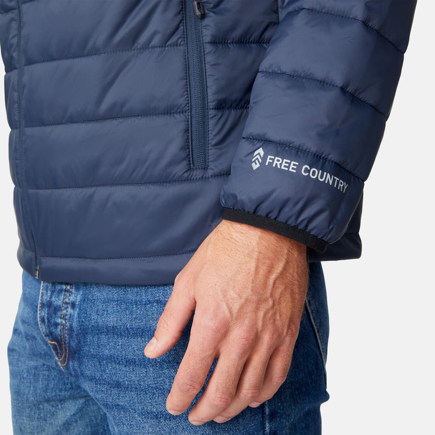 [Matt is 6'2" wearing size M.] Men’s Free Country zip-front puffer jacket in navy with multicolored horizontal chest stripes—featuring full-length zipper closure, insulated design, and classic hood-free silhouette. Paired with a white shirt and blue jeans for a vibrant, cold-weather look with retro-inspired flair.