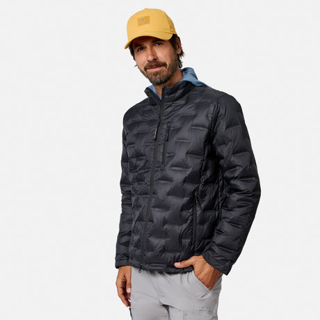[Model is wearing size M.] A man wearing a black hooded puffer jacket, a yellow baseball cap, and light gray pants, standing against a light gray studio background.