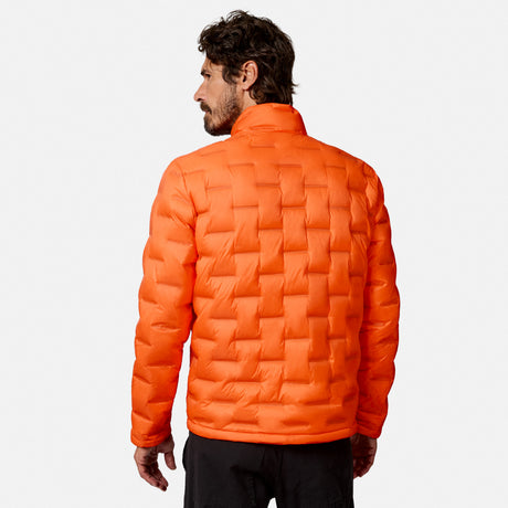 [Model is wearing size M.] A man wearing a bright orange quilted puffer jacket, shown from the back against a light gray studio background.
