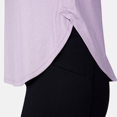 Close-up of a person in the Women's Microtech® Chill B Cool Curved Hem Tank Top by Clearance, featuring ultra-soft fabric, UPF 50+ sun protection, curved seam, and rounded hem, paired with black leggings.