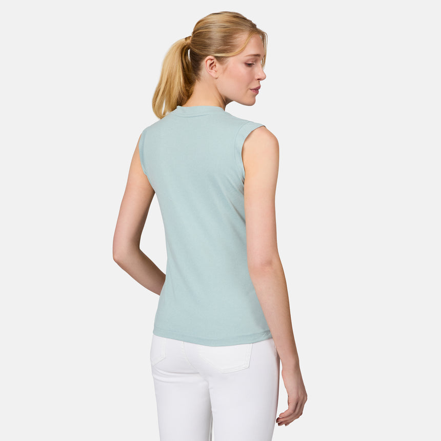 [Emily is 5'10" wearing size S] Woman wearing a light green sleeveless top and white pants on a plain background