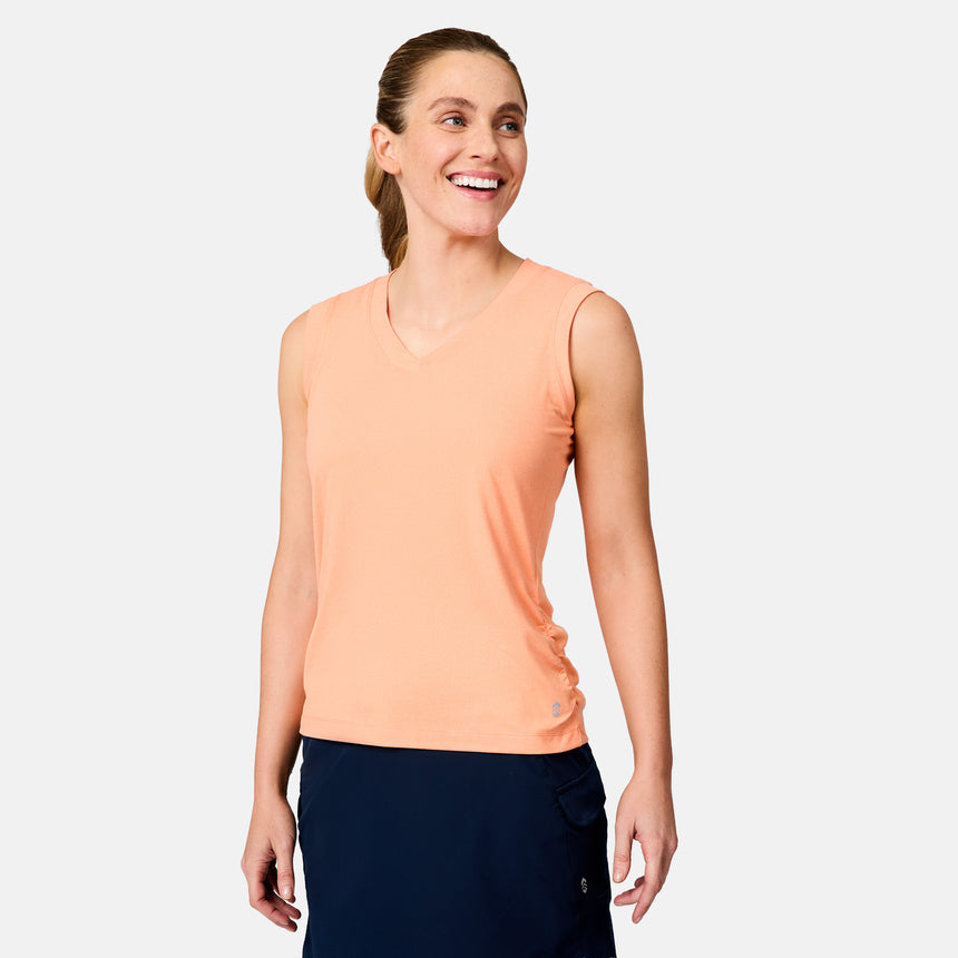 [Brooke is 5'9" wearing size S] Woman wearing a peach sleeveless top and navy pants on a light gray background