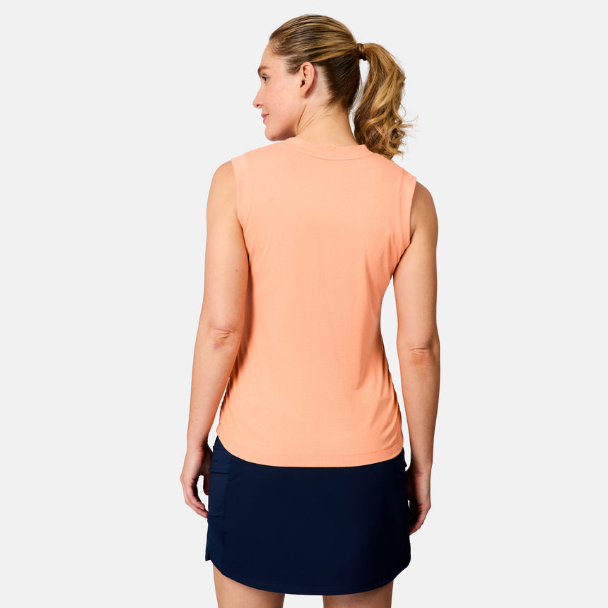 [Brooke is 5'9" wearing size S] Woman wearing a peach sleeveless top and navy skirt on a white background