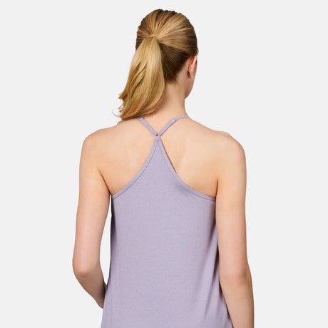 A blonde woman in a ponytail is seen from the back wearing the Free Country Women's Microtech® Chill B Cool V-Neck Cami Top with Built-In Bra in light purple, featuring a racerback design. The background is plain white.