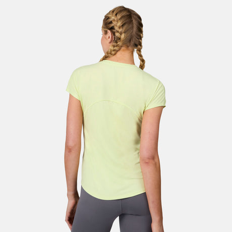 A woman with blonde hair in two braids is shown from the back, wearing a light yellow Women's Microtech® Chill B Cool Tee by Free Country and gray leggings, standing against a plain white background.
