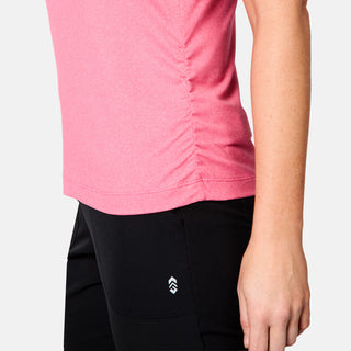 [Brooke is 5'9" wearing size S] Person wearing a pink long-sleeve shirt and black pants with a logo on a light gray background