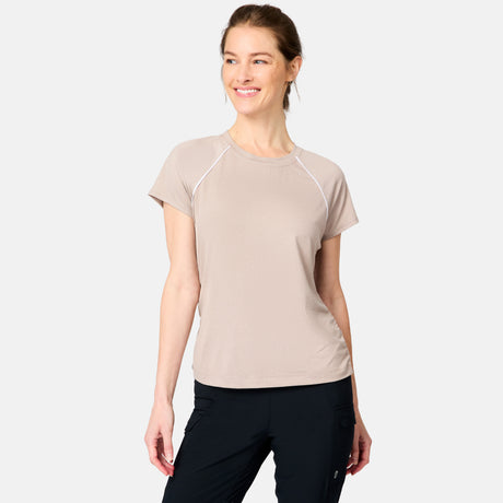 [Kaitlyn is 5'9" wearing size S] Woman wearing a beige athletic shirt and black pants on a white background