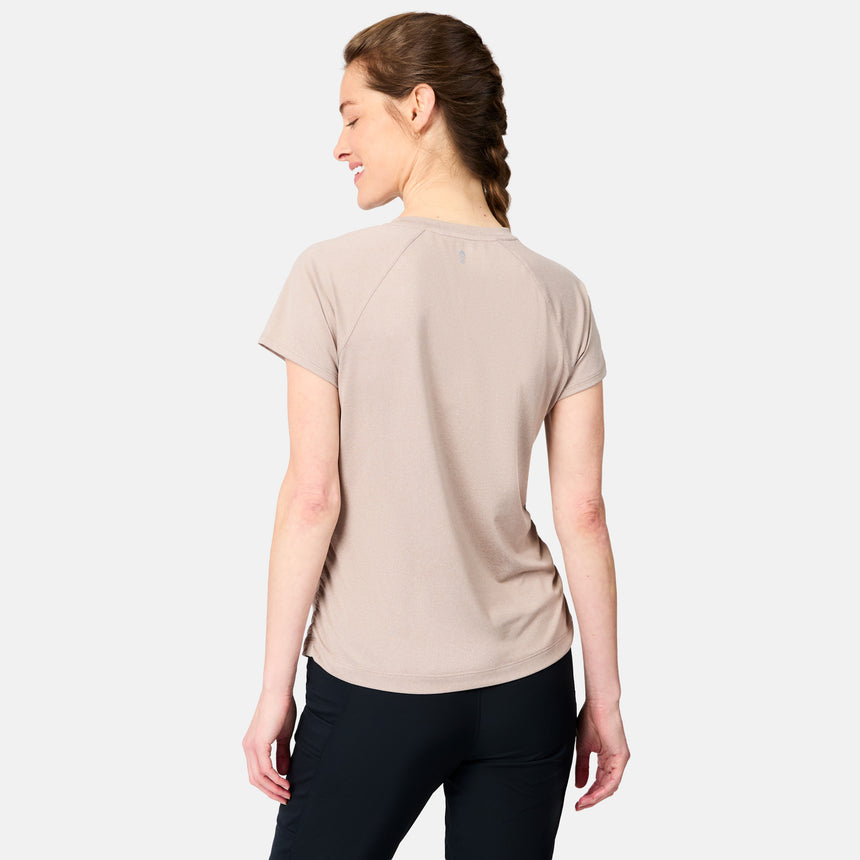 [Kaitlyn is 5'9" wearing size S] Woman wearing a beige t-shirt and black pants on a white background
