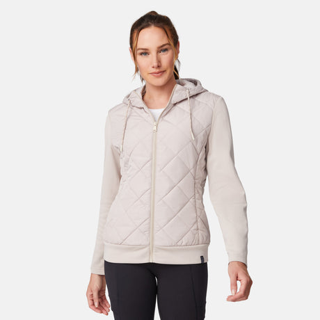 [Emily is 5'9" wearing size S.] Women’s light-colored quilted jacket with diamond-pattern stitching, zip-front closure, hood, and zippered pockets—layered over a white long-sleeve shirt and styled with black pants for a casual, cool-weather look.