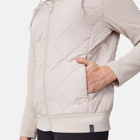 [Emily is 5'9" wearing size S.] Women’s light-colored quilted jacket with diamond-pattern stitching, zip-front closure, hood, and zippered pockets—layered over a white long-sleeve shirt and styled with black pants for a casual, cool-weather look.