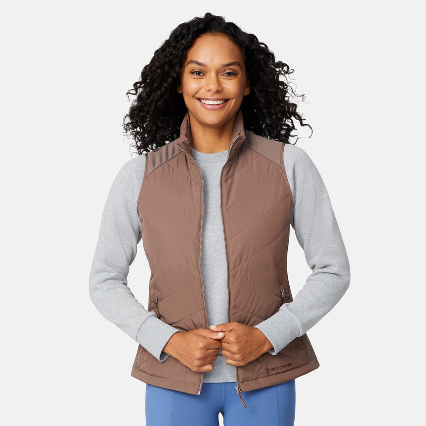 [Angelique is 5'10" wearing size S.] Woman wearing a brown quilted vest over a gray long-sleeve shirt on a white background