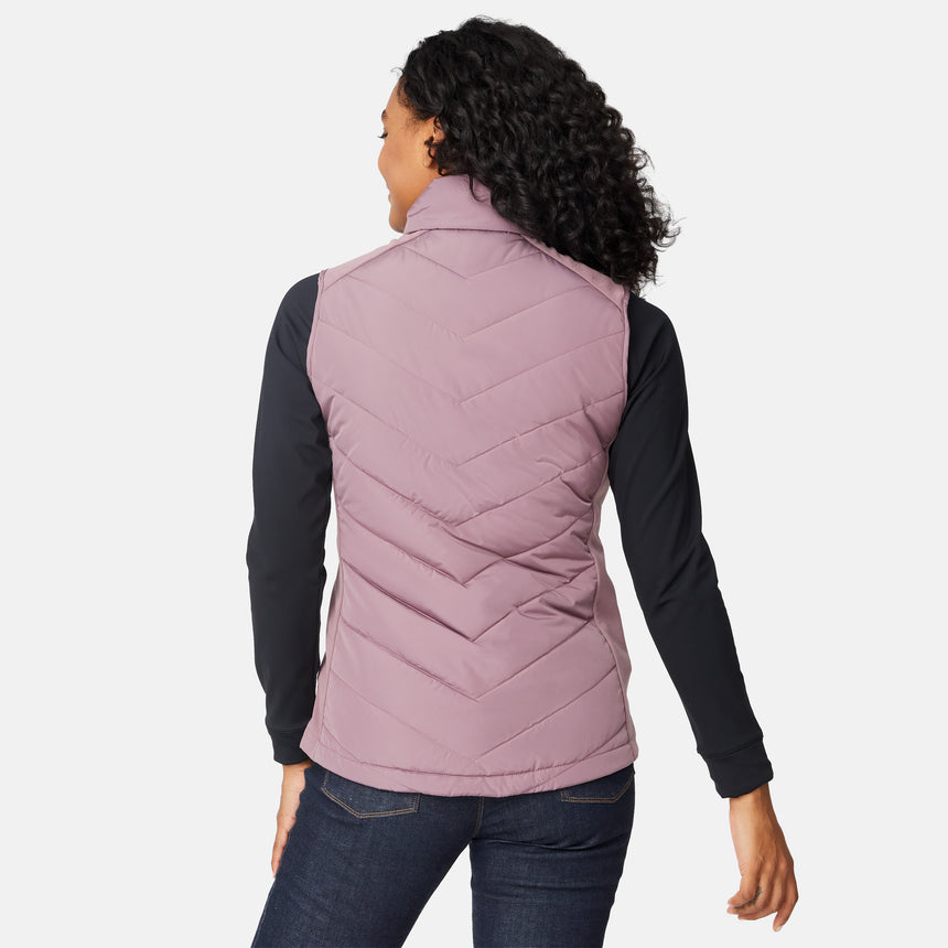 [Angelique is 5'10" wearing size S.] Woman wearing a purple quilted vest over a black long-sleeve shirt on a white background