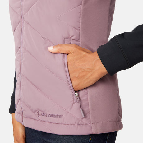 [Angelique is 5'10" wearing size S.] Woman wearing a purple quilted vest over a black long-sleeve shirt on a white background