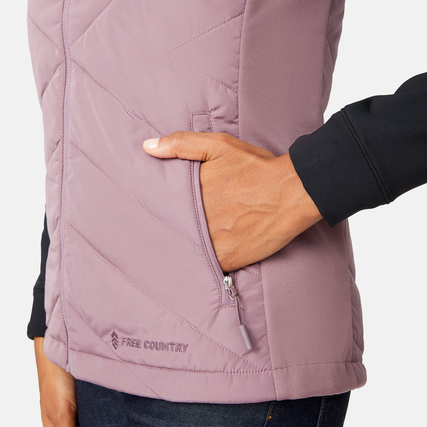 [Angelique is 5'10" wearing size S.] Woman wearing a purple quilted vest over a black long-sleeve shirt on a white background