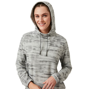 A woman smiles at the camera, wearing the Clearance Women's Luxe Easy Fit Pullover in light gray with a pattern and hood up, against a plain white background.