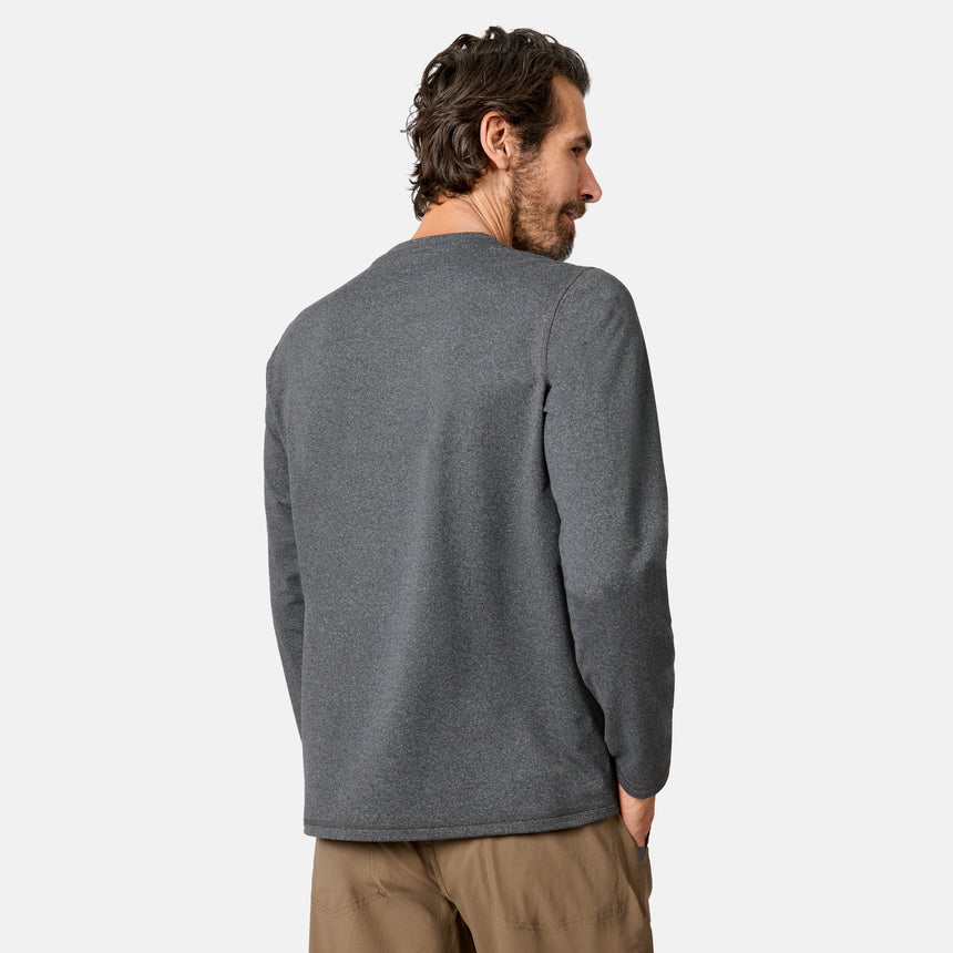 [Model is wearing size M.] A man wearing a dark gray long-sleeve crewneck sweater, shown from the back and side profile against a light gray studio background.