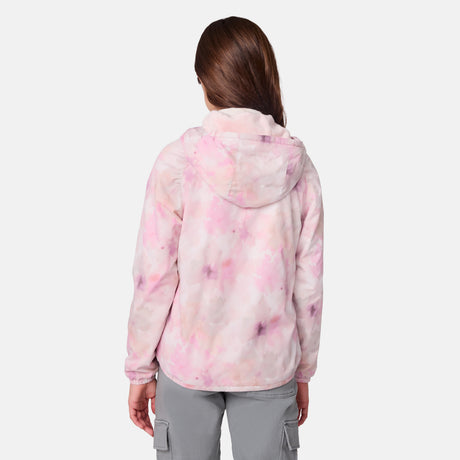 A girl with long brown hair, seen from behind, wears the Clearance Girls' Windshear Jacket in light pink and white tie-dye with gray cargo pants against a plain white background.