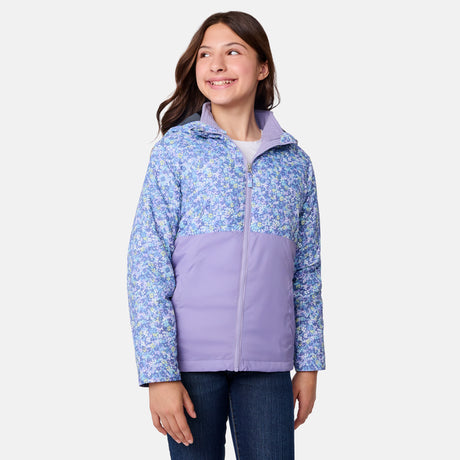 [Samantha is wearing size M.] Women's Free Country softshell jacket with floral upper print and solid lavender lower panels, featuring a zip-front closure and soft purple inner lining—designed for lightweight warmth and outdoor versatility.