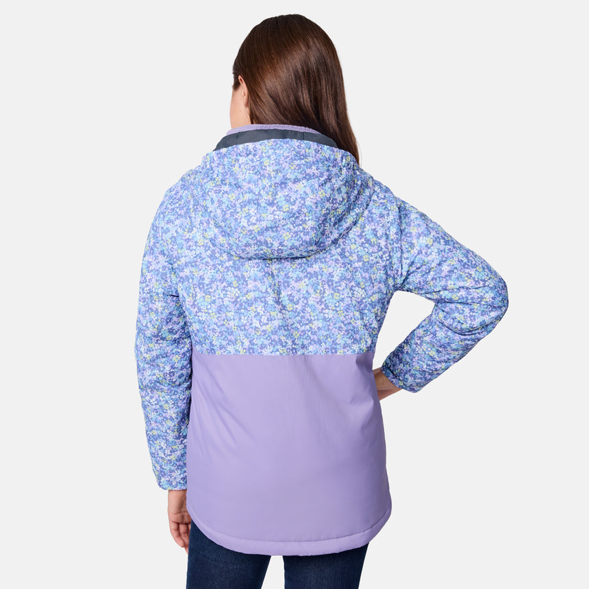 [Samantha is wearing size M.] Women's Free Country softshell jacket with floral upper print and solid lavender lower panels, featuring a zip-front closure and soft purple inner lining—designed for lightweight warmth and outdoor versatility.