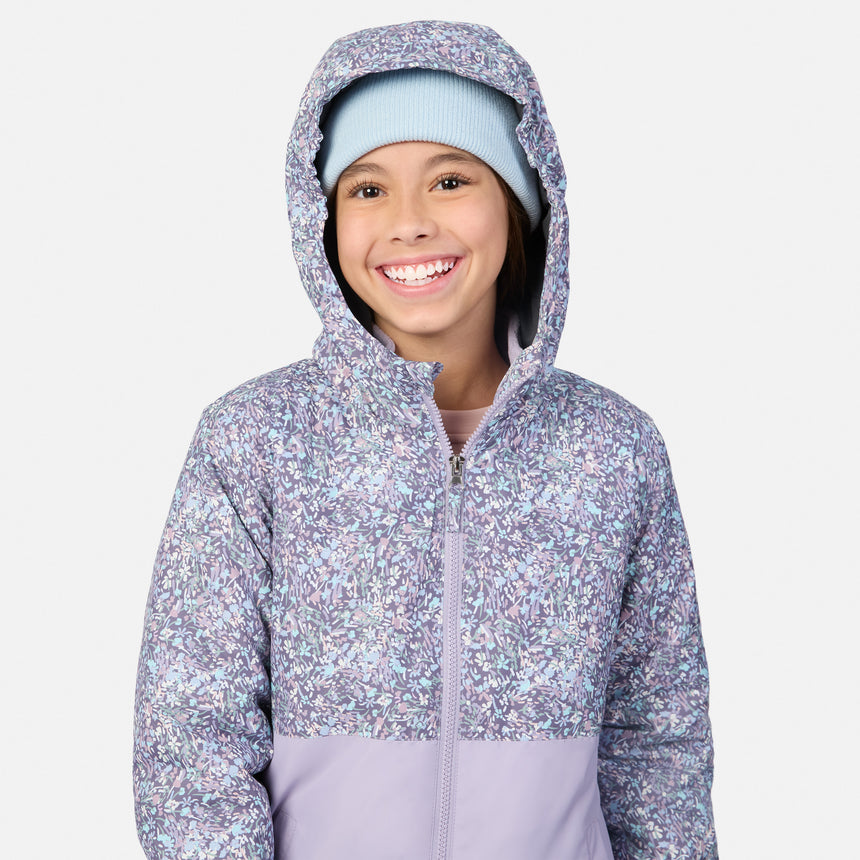 Girl wearing Girls' 3-in-1 Systems Jacket with lavender floral pattern and her hand in the pocket