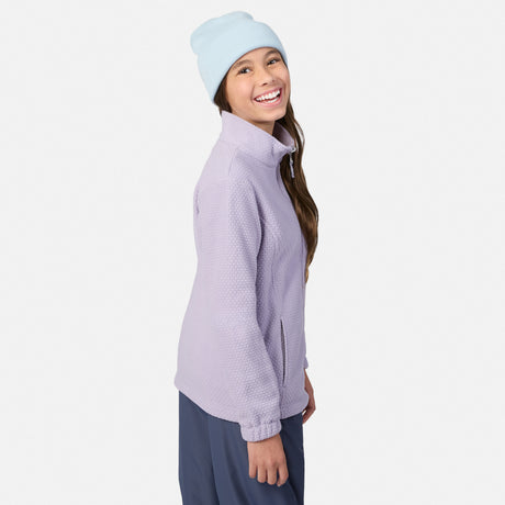 Girl in a light blue beanie and lavender 3-in-1 jacket shown in profile with pink top beneath