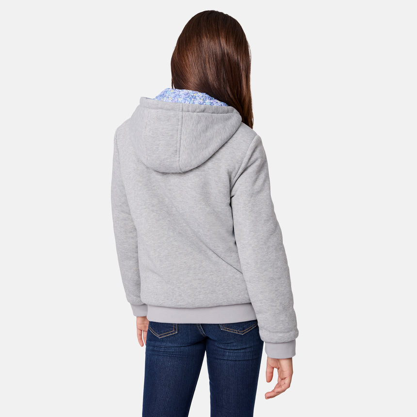 [Samantha is wearing size M.] Model wearing Free Country blue floral-patterned zip-front jacket with gray ribbed cuffs and hem—reverses to a solid gray hoodie for dual styling. Paired with a light gray turtleneck and dark blue jeans for a cozy-cool winter vibe.