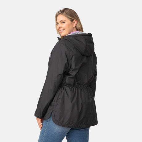 [Angela is 5'10" wearing a size 1X.] Woman wearing Free Country Women's Cascade Windshear Jacket in black with a full front zipper opening, soft lining, and water resistant and wind resistant recycled polyester stretch performance fabric, light grey background. Best women’s jacket for windy weather.