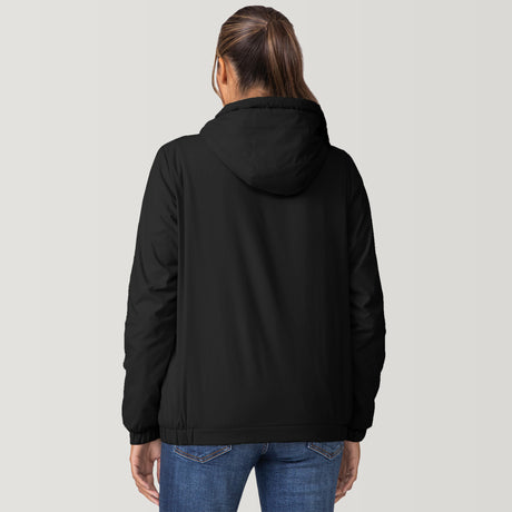 [Shelby is 5'9" wearing a size Small.] Woman wearing the Free Country Women's Breezy Bomber Windshear Jacket in black, featuring a hooded design and Iced Butter Pile® lining, standing casually with hands in pockets against a plain background.