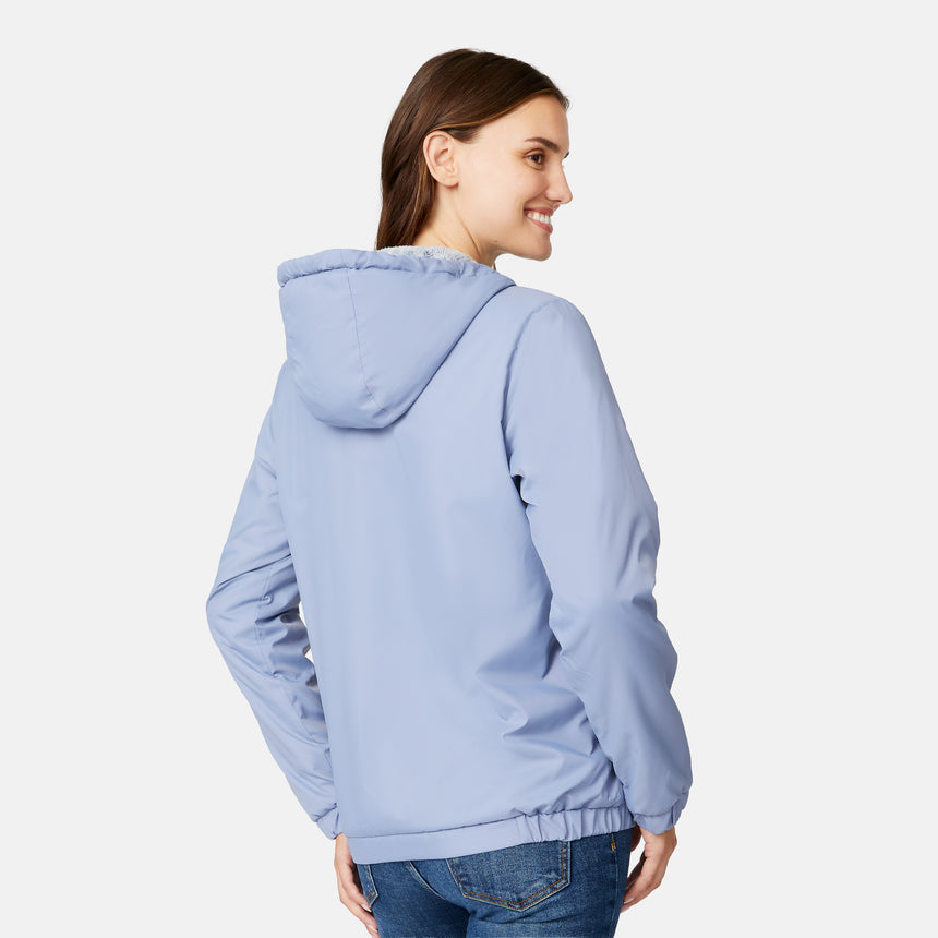 [Jessica is 5'9.5" wearing size S.] Women’s Free Country light blue hooded jacket with full-zip closure, zippered side pockets, and drawstring hood—sherpa lined for added warmth and comfort. Paired with blue jeans for a cozy, cold-weather look.