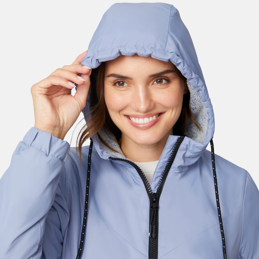 [Jessica is 5'9.5" wearing size S.] Women’s Free Country light blue hooded jacket with full-zip closure, zippered side pockets, and drawstring hood—sherpa lined for added warmth and comfort. Paired with blue jeans for a cozy, cold-weather look.