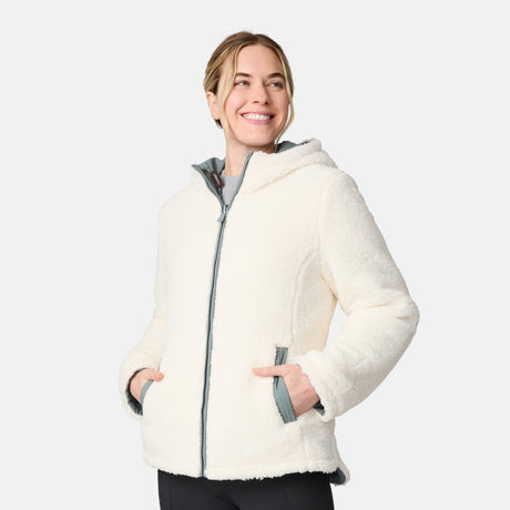 [CJ is 5'10" wearing size S.] Women’s Free Country light green quilted hooded jacket with full-zip closure, drawstring hood, and dual hand pockets—reversible to cozy sherpa for added warmth and comfort. Paired with jeans and a casual top for a laid-back, cold-weather look.