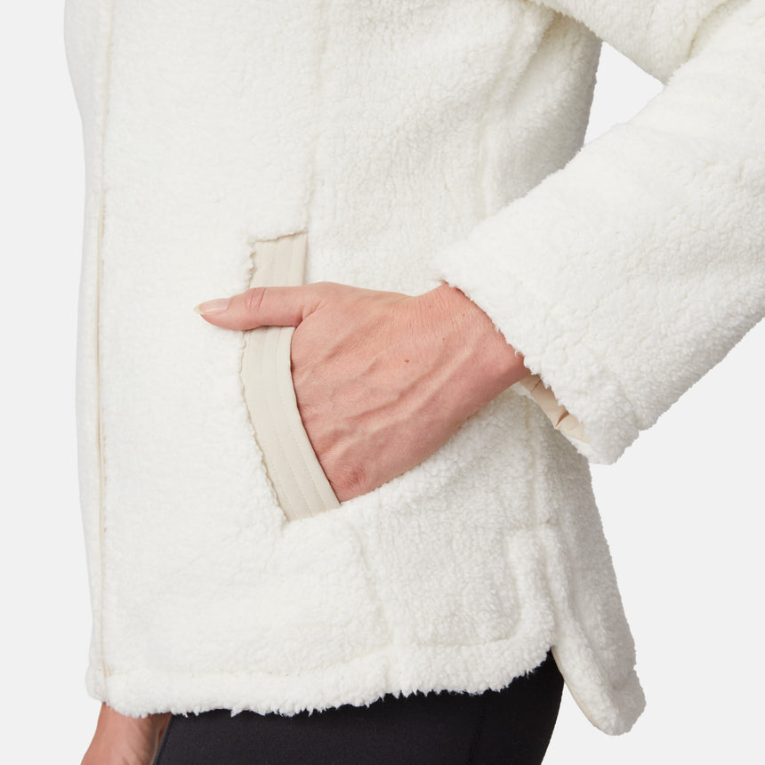 [Emily is 5'9" wearing size S.] Women’s Free Country cream-colored quilted hooded jacket with full-zip closure, drawstring hood, and dual hand pockets—reversible to cozy sherpa for versatile styling and added cold-weather comfort. Styled with jeans for a relaxed, outdoorsy look.