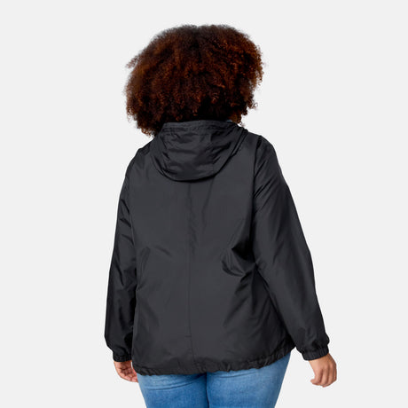 A woman with curly hair is seen from behind wearing the Clearance Women's Plus Size Outland Windshear Jacket in black with a hood, paired with blue jeans, set against a plain light background.