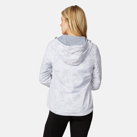 A woman with blonde hair wears the Clearance Women's Outland Windshear Jacket over a gray top and black pants, standing with her back to the camera against a plain white background.
