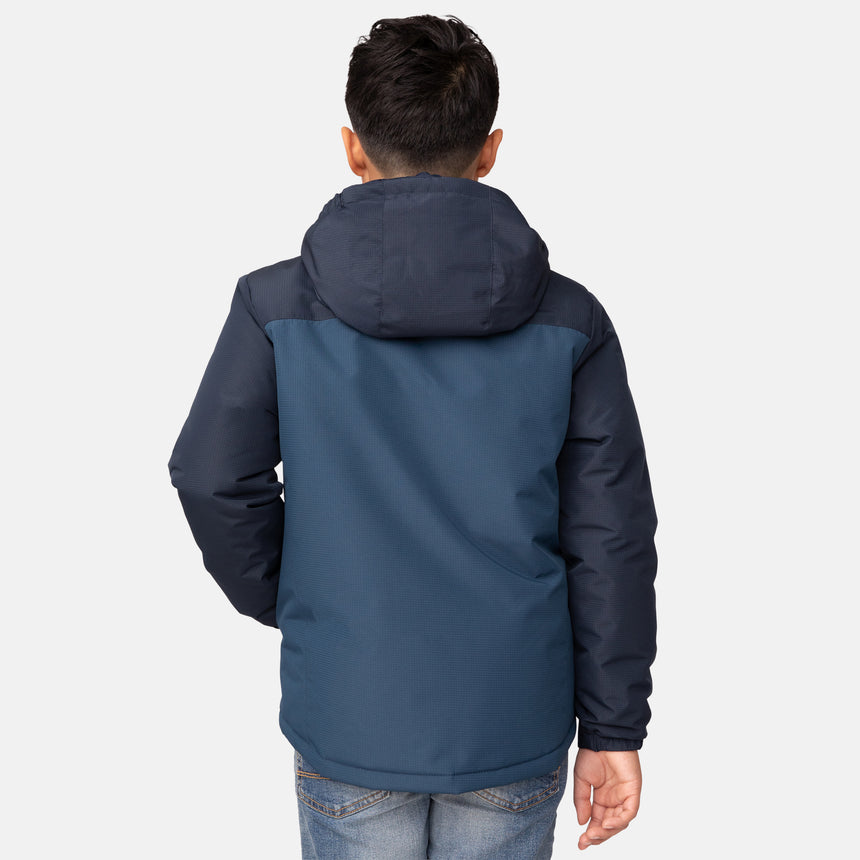 [Model is wearing size M.] Boy’s blue and navy hooded jacket with zippered chest pocket and side hand pockets — insulated cold-weather layer for everyday wear