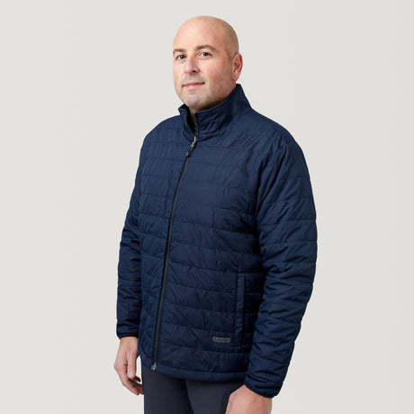 A man wearing the Men's FreeCycle® Jack Frost 3-in-1 Systems Jacket by Clearance stands against a plain light gray background, looking at the camera with a neutral expression.