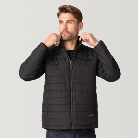 A man with light brown hair and a beard wears the Men's FreeCycle® Jack Frost 3-in-1 Systems Jacket by Clearance in black. He looks to the side, adjusting the collar with both hands against a plain light gray background.